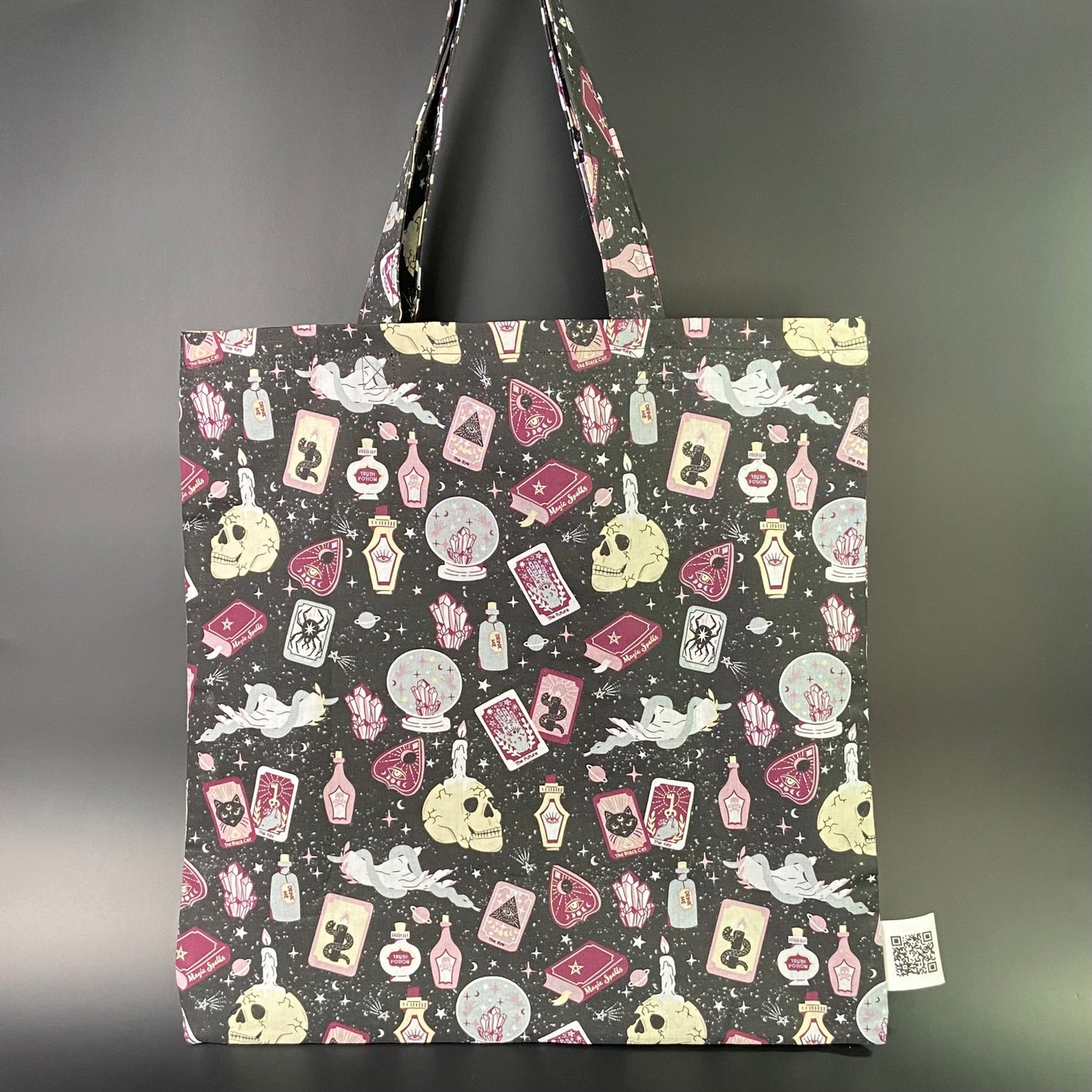 Spellbound on Black Folding Tote Bag