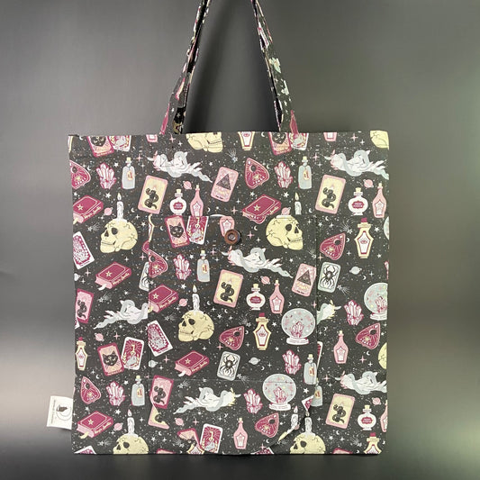 Spellbound on Black Folding Tote Bag